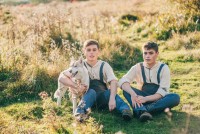 depositphotos_106036892-stock-photo-two-twin-brothers-with-husky
