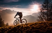mountain-bikes-athlete-man-mountains-meadow-trees-forest-sky
