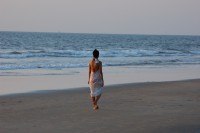 woman-sunset-waves-ocean-beach.jpg