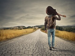 bigstock-young-musician-on-the-road-to-52068637