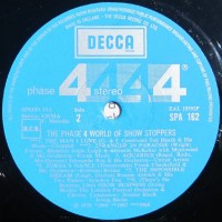 phase-4-world-of-show-stoppers---label-side-2