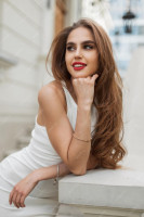 urban-female-fresh-portrait-beautiful-cute-girl-model-with-red-lips-fashion-white-elegant-dress-stands-poses-near-vintage-building_338491-22394